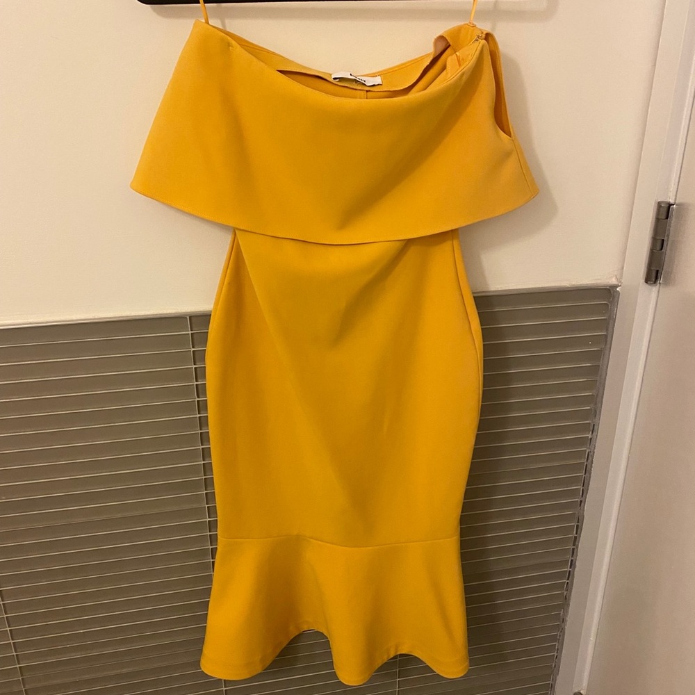 Likely strapless dress in yellow.